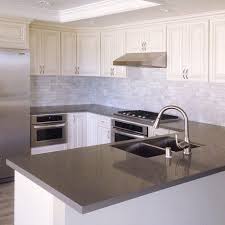 Simplykitchens carries quartz and granite countertops at very competitive prices. U Shaped Kitchen With Antique White Cabinets Grey Quartz Countertop Undermount Sink And Single Handle Pull Out Faucet Kitchencabinet Kitchenremodel Proper White Kitchen Remodeling Gray Kitchen Countertops White Modern Kitchen