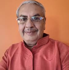 Leena Chandavarkar, Kishore Kumar, and their young son Sumit Kumar are  captured in a joyous family moment, cutting a special cake together. Leena,  draped in a radiant outfit, beams with warmth and