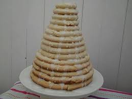 The crispy cakes are made with ground almonds, sugar, and egg whites, and are held together with a white icing glaze if you need your order on the same or next day. Kransekake Granny S Kitchen