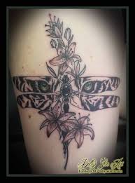 So in the tattoo below they surround the rose, which symbolizes love. Danielle S Dragonfly With Lilies Dolly S Skin Art Tattoo Kamloops Bc