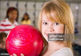 Woman Aiming Bowling Ball Closeup High-Res Stock Photo