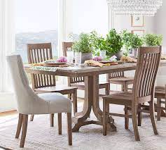 Each dining chair is upholstered in plush velvet with gold nailhead trim. Hayes Tufted Upholstered Dining Chair Pottery Barn