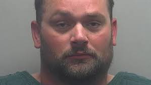 Man charged with terror threats against school