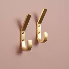 However, dont put too many hooks on one wall so you can avoid a cluttered look. Solid Brass Tapered Hook Brass Coat Hook Key Hooks Gold Etsy Brass Coat Hooks Brass Clothes Clothes Hooks