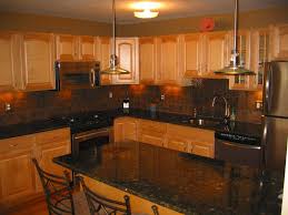 Dark cherry cabinets, uba tuba granite countertops, and neutral colored floor and wall tile. Pin By Robin On Home Ideas Oak Cabinets Kitchen Paint Kitchen Redo