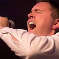 A Mongolian boy sings for distinguished visitors during