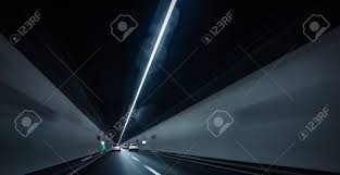 Cars On A Highway Going Through A Long Modern Tunnel (motion ...
