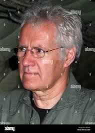U.S. Air Force Captain Alex Kenney, a pilot with the 167th Airlift  Squadron, boards a C-17 Globemaster III aircraft during a simulated  chemical environment training at the 167th Airlift Wing, Martinsburg, West
