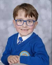 School picture retakes are finally in. Both are much better, but they sure  did poor Harry dirty initially