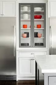 white cabinets with gray glass front