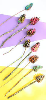 Paige hemmis is showing you how to take ordinary pine cones and turn them into a centerpiece of flowers.get paige's pine cone centerpiece isntructions here: Beautiful Drip Painted Pine Cone Flower Craft Emma Owl