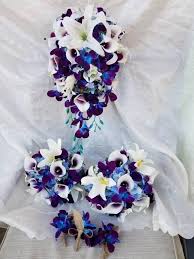 The top countries of suppliers are thailand. Cascading Bridal Bouquet Galaxy Orchids Lilies Picasso Etsy Cascading Bridal Bouquets Bridal Bouquet Blue Orchid Bouquet