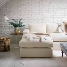 Here is living room with one drywall and one stone wall. All White Living Rooms Decorating Ideas