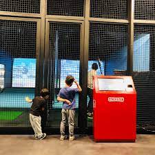 The men's golfers are out doing their golf at the moment. Indoor Golf Range Batting Cage Machine Baseball Pitching Machine