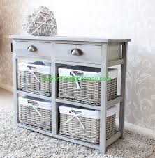 I love how some parts of the storage unit have been kept open so that decor pieces can be displayed in them. Vintage Grey Range Two Drawer And Four Wicker Basket Storage Unit Buy Arts And Crafts Storage Units Bedroom Storage Unit Lockable Storage Units Product On Alibaba Com