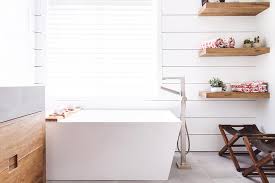 Shop for white wicker bathroom shelf online at target. Stacked Wooden Floating Bath Shelves Next To Bathtub Transitional Bathroom