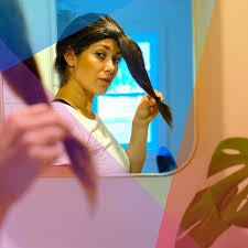 Cut straight across to create even layers. Trimming Hair At Home Use The Ponytail Haircut Trend