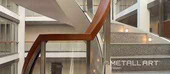 Wood can easily be used with a glass deck railing whether its a suburban or rural outdoor setting. Glass Railings With Wooden Handrail In Frankfurt Metallart Stairs