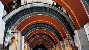 The idea that form should follow function (functionalism); Elegance Escalated How Spiral Escalators Form Distinctive Luxury Spaces Our Stories Mitsubishi Electric Global Website