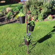 They are perfect for indoor flowers or can also be used outside. Tall Metal Tap Triple Garden Planter With Plant Pots