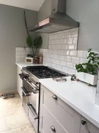 Our summer kitchen sale is now on. Grey Howdens Burford Kitchen With White Subway Tiles And White Corian Worktop Modernhomedecork Kitchen Remodel Interior Design Kitchen Small Howdens Kitchens