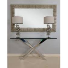 The table is constructed of sturdy metal and comes in a pewter finish. Cleo Console Table In Polished Stainless Steel With Glass Top Furniture By Room 2936 Sena Home Furniture