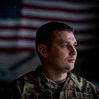 U.S. Marine Corps Staff Sgt. Matt Houle, right, and