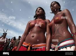 EDS NOTE NUDITY - Girls from the Pataxo tribe watch a canoe race on the  Tocantins River, during the Indigenous Games on the island of Porto Real in  the city of Porto