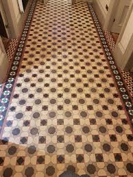Mixed with tile floor, wooden staircase with green runner, beautiful leaf statue on the shelf greeting. Entrance Hall Tiles Archives North West Yorkshire Tile Doctor