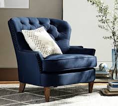 Armchairs and bedroom corners are a timeless combination, and an effortless way to create a cozy reading nook with plush, convenient seating. Cardiff Tufted Upholstered Armchair With Nailheads Pottery Barn