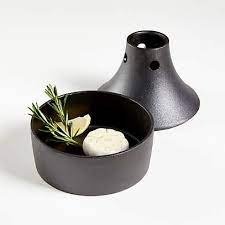 Filled with beer and herbs, this roaster infuses chicken with flavor as it roasts while allowing fat to drip away. Outset Cast Iron Beer Can Chicken And Garlic Roaster Reviews Crate And Barrel