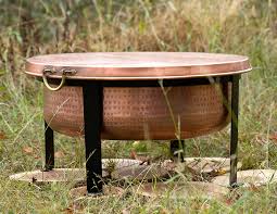 A fire pit is a great way to spend a summer night outdoors or keep warm when the weather gets chilly. Handcrafted Copper Fire Pit Grill Table