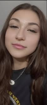 A close up of a woman with long hair and a necklace - SeaArt AI