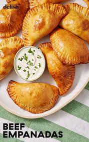 Cheesy Beef Empanadas Are The Perfect Excuse To Eat With Your Hands Recipe Recipes Beef Empanadas Empanadas Recipe