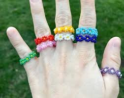 Then add two more and pull the string through the bead on the right. Custom Bead Ring Single Seed Bead Ring Seed Bead Ring Dainty Ring Stackable Ring Colorful Bead Ring Rainbow Bead Ring Christmas Gift In 2021 Beaded Rings Rainbow Beads Floral Jewellery