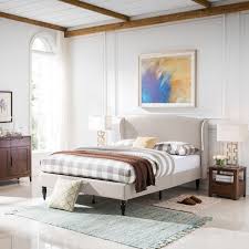 A sturdy bed frame with soft, profile edges and high legs. Queen Wingback Upholstered Bed Frame With Turned Legs Nh889603 Noble House Furniture