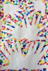 Multi-Color Dots surrounding multiple hand prints. The image demonstrates mixing things up.