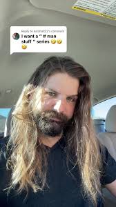 That One with A Man Holding A Old Book