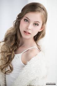 A younger girl posing for a photo.