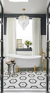 Integrating texture in the tiling and blinds adds personality and life a simple color scheme. Black And Tan Bathroom Decor Beautiful Bathroom Decor Bathroom Lighting Design Bathroom Design