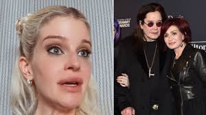 Pamela Anderson blows a kiss to boyfriend Adil Rami at World Cup game