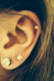 My Gorgeous New Piercings Small Crystal Set In Gold In The Cartilage Small Pearl Set In Gold In The Upper Second Lobe Piercing Cute Ear Piercings Ear Jewelry