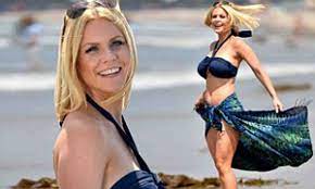 Carrie Keagan shows off her busty figure in a navy bikini for a day at the  beach | Daily Mail Online
