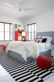 Black And White Rug Bedroom Unique Kid S Bedroom Is Cooled By A Modern White Ceiling Fan Hung Over A Black And White Striped Rug Placed Beneath Kid Room Decor Room Design Cool Kids Rooms