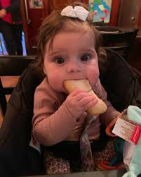 It's only right part of our 5th generation, Briella, has her first piece of  Italian bread at Angelo's 💕 That's amore!