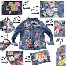 Create Your Own Embellished Disney Jean Jacket With Patches Buttons And Pins Visit The Shops Of Gopinpro Lillian Diy Jacket Diy Denim Jacket Disney Jacket
