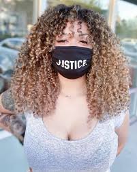 You can't go wrong with this combo. 20 Flawless Curly Hair Highlights To Bring Your Locks To Life