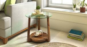 Glass coffee tables are modern and elegant, while also creating the illusion of space because of its clarity and transparent nature. Jones Glass Top Side Table Urban Ladder
