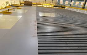 The bottom of this deck is painted white to maximize lighting underneath the mezzanine/work platform. Mezzanine Decking Materials Solid Surface And Permeable Options