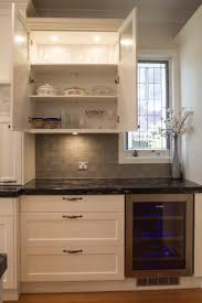 Traditional Kitchen With Windowed Overhead Cabinets Www Thekitchendesigncentre Com Kitchen Inspiration Design Traditional Kitchen Design Tuscan Kitchen Design